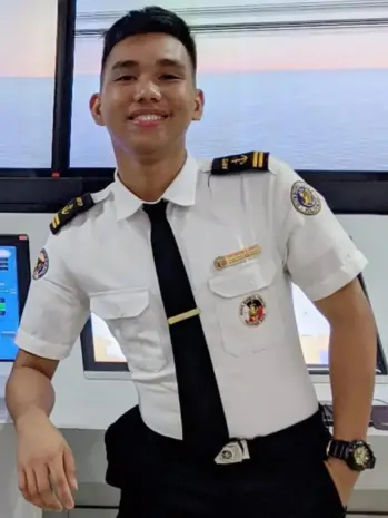 A person in uniform smiling-Christian Dave Catayoc